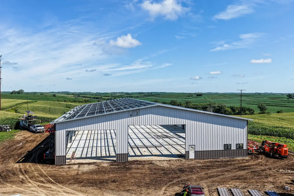 Steel frame building under construction with the frame and panels going on